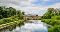 Train crossing the new railway bridge at Ocean on the Stroudwater canal, Stonehouse, Stroud, UK