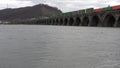 Train crossing river on Stone Bridge