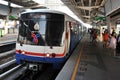 Train Departs a Station in Bangkok Royalty Free Stock Photo