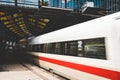 Train departure at train station - motion blur of train leavin Royalty Free Stock Photo