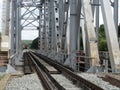 A train in the distance rides across the bridge Royalty Free Stock Photo