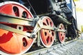 Train drive mechanism and red wheels of an old soviet steam locomotive Royalty Free Stock Photo