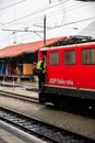 Train driver entering his locomotive. Grisons, Switzerland Royalty Free Stock Photo