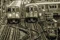 Train on elevated tracks within buildings at the Loop, Chicago City Center - Black Gold BW Artistic Effect - Chicago