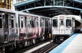 Train on elevated tracks within buildings at the Loop, Chicago City Center - Bleached Portrait Artistic Effect