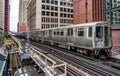 Train on elevated tracks within buildings at the Loop, Chicago City Center - Chicago, Illinois Royalty Free Stock Photo