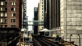 Train on elevated tracks within buildings at the Loop, Chicago City Center - Sepia Glow Artistic Effect - Chicago, Illinois Royalty Free Stock Photo