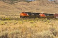 Train engines pulling boxcar