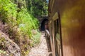 Train enters a tunnel near Idalgashinna, Sri Lan