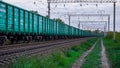 A train full of only new green freight cars