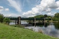 Train girder bridge across River Lochy near Inverlochy Castle in nice sunny summer weather with blue sky and clouds