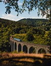 A train going over a beautiful viaduct