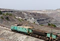 Train at the iron ore opencast mine is going for loading Royalty Free Stock Photo