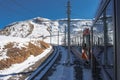 Scenic train journey through Zermatt ski resort area, Switzerland.