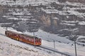 Train in Kleine Scheidegg under Eiger, Monch and Jungfrau peaks in Swiss Alps, Berner Oberland, Grindelwald,