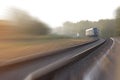 Train leaving the station on foggy morning. Industrial landscape Royalty Free Stock Photo