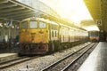 Train led by Old yellow Diesel Electric locomotives at Bangkok Railway Station Royalty Free Stock Photo