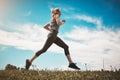 Train like a beast, look like a beauty. a young woman out on a trail run.