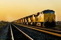 Train locomotive traveling through desert