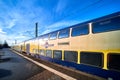 Train of the Metronom regional train stands on the tracks at the platform edge of the station in Uelzen, Germany, December 18.,