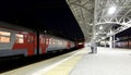 Train on Moscow passenger platform at night (Belorussky railway station) is one of the nine main railway stations in Moscow Royalty Free Stock Photo