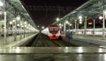 Train on Moscow passenger platform at night (Belorussky railway station) is one of the nine main railway stations in Moscow Royalty Free Stock Photo