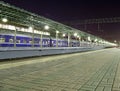 Train on Moscow passenger platform at night (Belorussky railway station) is one of the nine main railway stations in Moscow Royalty Free Stock Photo