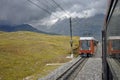 Train in motion and the Swiss Alps Mountains in background