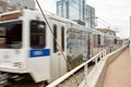 Train in motion under Millennium Bridge at Commons Park in Denver, Colorado Royalty Free Stock Photo