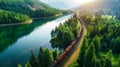 A train moves through a dense green forest filled with tall trees and lush foliage Royalty Free Stock Photo