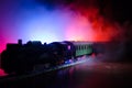 Train moving in fog. Ancient steam locomotive in night. Night train moving on railroad. orange fire background. Royalty Free Stock Photo