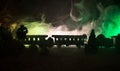 Train moving in fog. Ancient steam locomotive in night. Night train moving on railroad. toned foggy fire background. Horror mystic