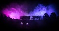 Train moving in fog. Ancient steam locomotive in night. Night train moving on railroad. toned foggy fire background. Horror mystic Royalty Free Stock Photo