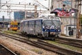 Train moving out of a station covered in graffiti in Zagreb, Croatia