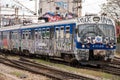 Train moving out of a station covered in graffiti in Zagreb, Croatia