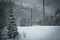 Train moving through the snowy woods Royalty Free Stock Photo