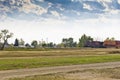 Train moving through small Canadian prairie town.