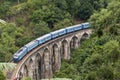 Train on Nine Arches bridge in hill country of Sri Lanka