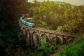 Train on the Nine Arches Demodara Bridge or the Bridge in the sky located in Demodara near Ella city, Sri Lanka. Royalty Free Stock Photo