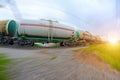 Train with oil tanks moving. Transportation of fuel on the railroad. Motion blur