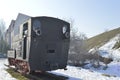 Train locomotive old in snow.