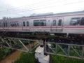 The train over the bridge in the past day in Indonesia? Royalty Free Stock Photo