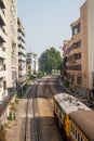 The train pass through the buildings in Bangkok