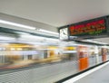 Train with passengers arriving at a station platform