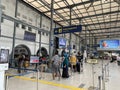 Train passengers standing in queue to enter into the train departure platform room at the famou \