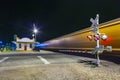 Train passes at railroad crossing in the night. The Kingman station of the Santa Fee railroad opened in 1907 and is still in use Royalty Free Stock Photo