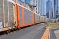 Train Passing with Downtown in the Background