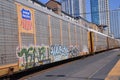 Train Passing with Downtown in the Background