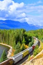 Train passing famous Morant`s curve in Banff ,Canada Royalty Free Stock Photo