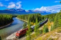 Train passing famous Morant`s curve in Banff ,Canada Royalty Free Stock Photo